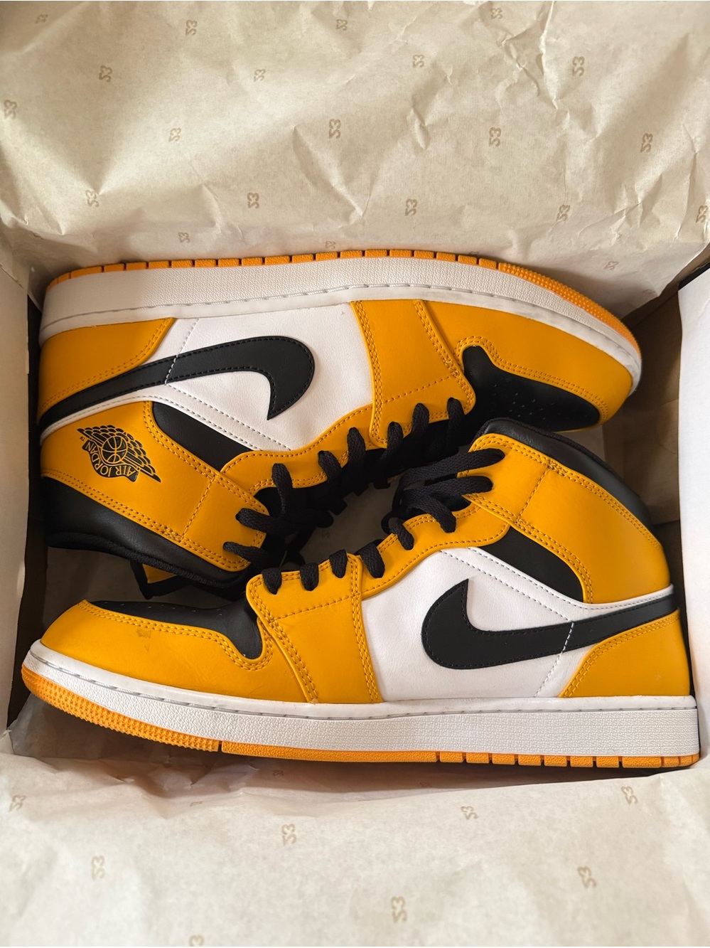 Jordan• 1 Mid in Taxi, Black, White